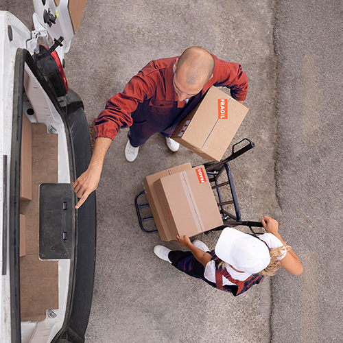 full-shot-delivery-people-holding-box edit 500x500